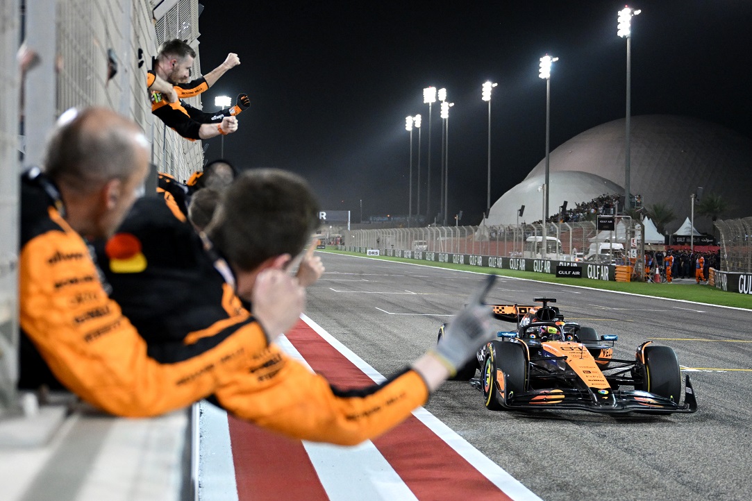 BAHRAIN, BAHRAIN - APRIL 13: Race winner Oscar Piastri of Australia driving the (81) McLaren MCL39 Mercedes crosses the line to cheers from his team on the pit wall during the F1 Grand Prix of Bahrain at Bahrain International Circuit on April 13, 2025 in Bahrain, Bahrain. (Photo by Sam Bagnall/Sutton Images)
