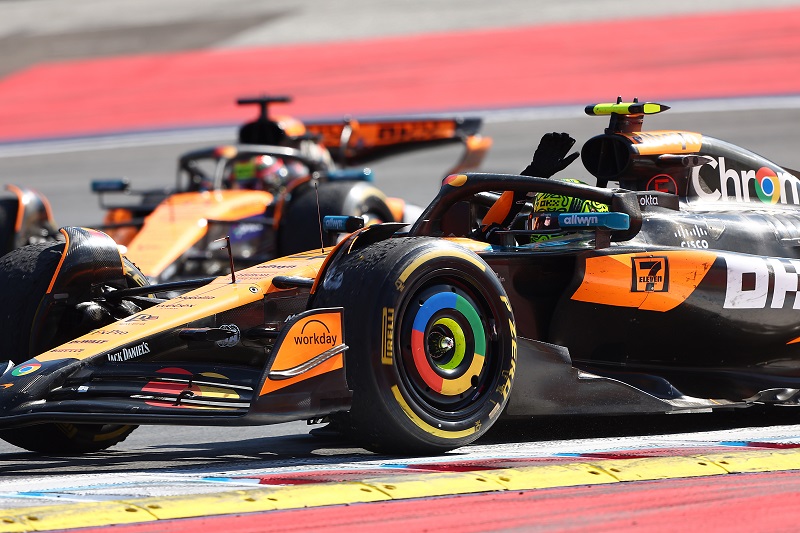 SPIELBERG, AUSTRIA - JUNE 29: Race winner Lando Norris of Great Britain driving the (4) McLaren MCL39 Mercedes waves to fans on his way to parc ferme during the F1 Grand Prix of Austria at Red Bull Ring on June 29, 2025 in Spielberg, Austria. (Photo by Andy Hone/LAT Images)