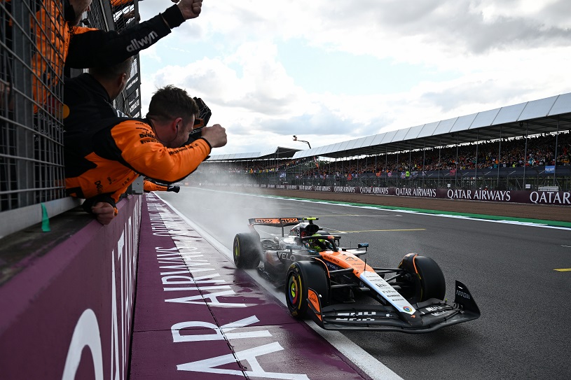 NORTHAMPTON, ENGLAND - JULY 06: Race winner Lando Norris of Great Britain driving the (4) McLaren MCL39 Mercedes passes his team on the pit wall after crossing the finish line during the F1 Grand Prix of Great Britain at Silverstone Circuit on July 06, 2025 in Northampton, England. (Photo by Sam Bagnall/Sutton Images)